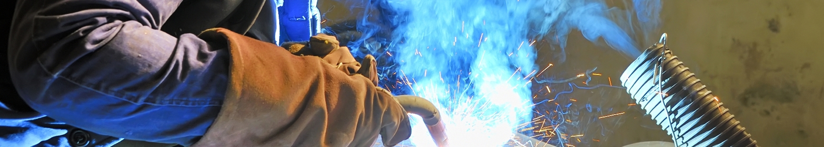 Photo of person welding