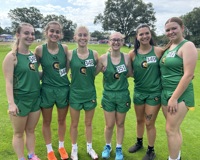 A group of six women's cross country runners from MCC pose for a group photo.
