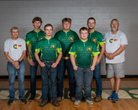 Five members of the MCC clay target team and two coaches pose for a team photo.