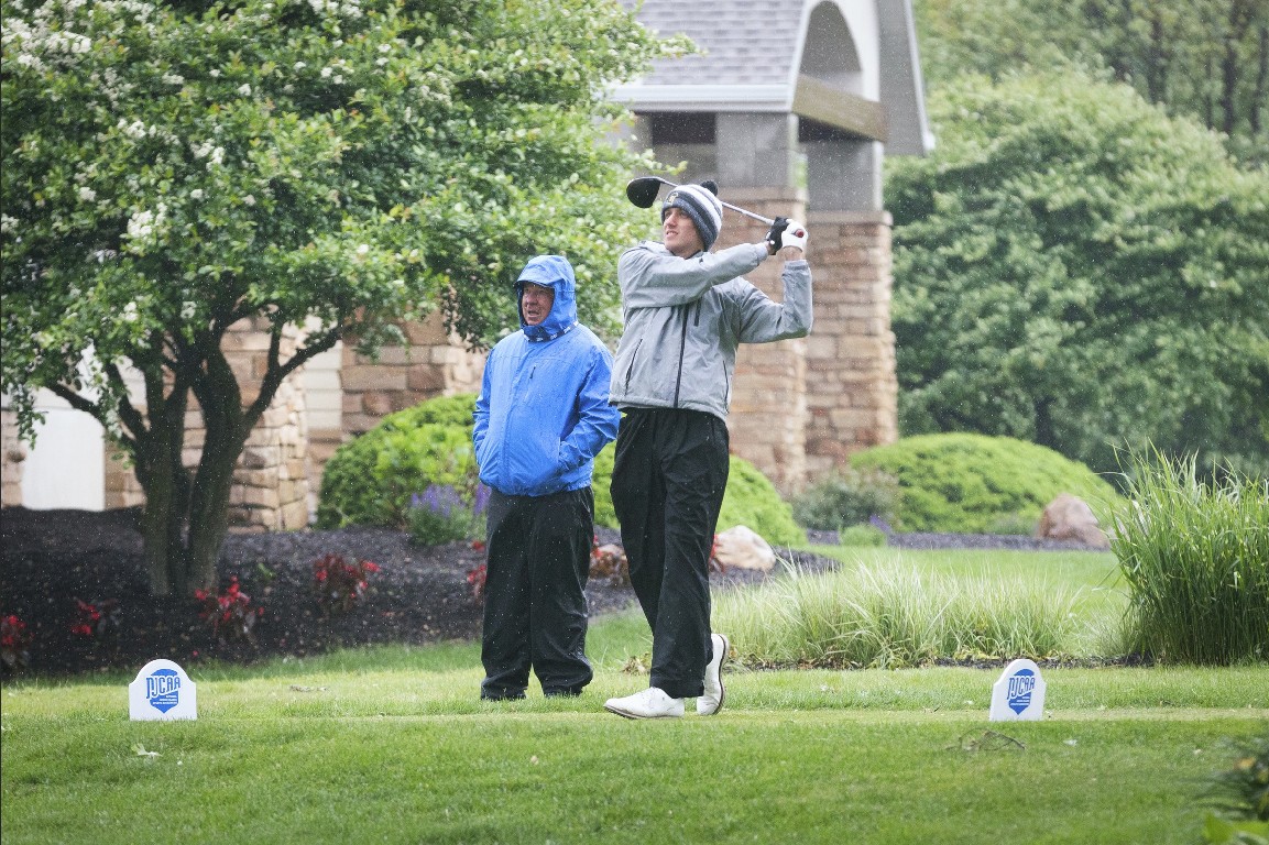 MCC men's golfer tees off in the rain.