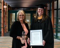 Photo of Lisa Lund in a cap and gown