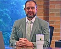 Photo of President Bradley Barrick at his office