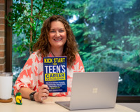 Picture of Amy Zdanowski holding a book