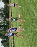 MCC cross country runner Annette Fare runs in a pack alongside three runners from other schools during a meet.