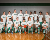 Members of the MCC men's basketball team form two rows as they pose for a team photo.