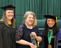 Photo of Sally Spry presenting an award