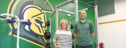 MCC Dean of Health and Human Services Tracy Zamarron and MCC Biology and Exercise Science Faculty Alex Montoye standing in front of weight equipment that will be used for the Exercixe Science program.