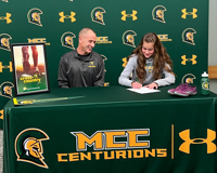 Annette Fare Signing a form