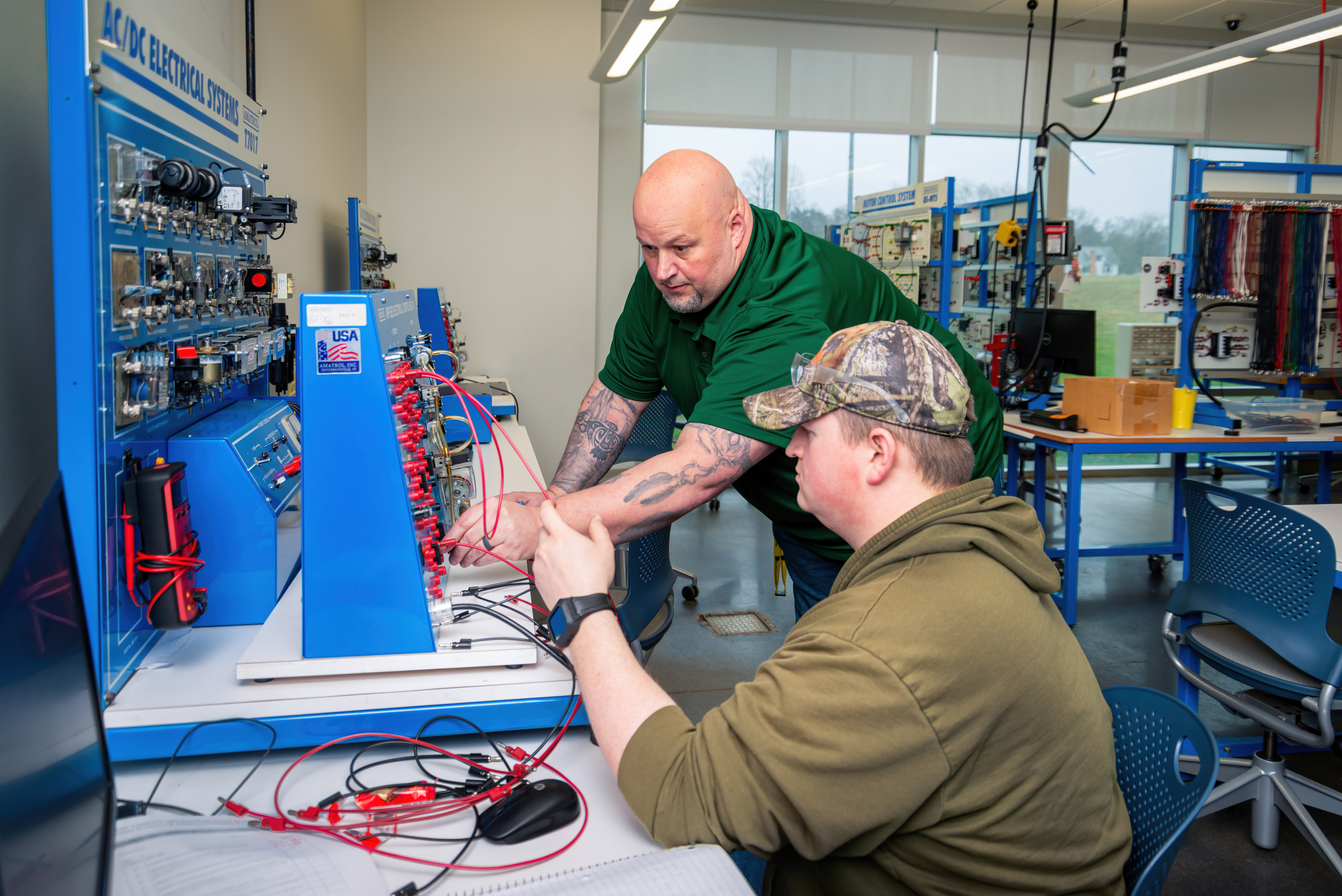 Adam Yuhas working with a student.